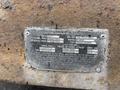 A metal identification plate with information about a 2015 Vermeer Corporation BC1200XL including VIN model type and tire specifications