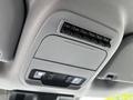 The overhead console of a 2024 Ford F-550 features six auxiliary switches and two interior lights