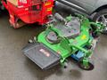 A 2014 John Deere 1585 Terrain Cut lawn mower with a green frame and black cutting deck positioned on a blue platform