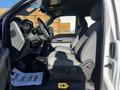 Interior view of a 2011 Ford F-350 SD showing front seats dashboard and steering wheel