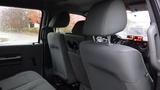 Interior view of a 2011 Ford F-550 showing back seats and dashboard controls