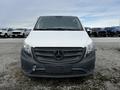 A 2018 Mercedes-Benz Metris van facing forward with a white front and black grille featuring the Mercedes-Benz logo in the center