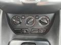 Control panel of a 2016 Ford Transit Connect featuring temperature and air conditioning dials along with various function buttons