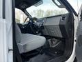 Interior view of a 2011 Ford F-750 showing a driver's seat dashboard and controls