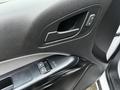 Interior door handle and power window controls of a 2018 Chevrolet Colorado