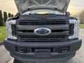 A 2018 Ford F-350 with the hood raised showing the front grille and headlights featuring the Ford logo prominently in the center