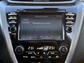 Interior dashboard of a 2021 Nissan Murano featuring a touchscreen display with audio options and climate control settings
