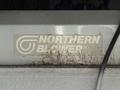 A close-up view of a Northern Blower logo on a piece of equipment with some rust marks visible on the surface