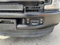 A close-up view of the front bumper area of a 2017 Ford F-250 SD showing the winch hook and mounting points without any license plate attached