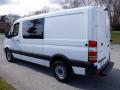 A white 2016 Mercedes-Benz Sprinter van with a sliding side door and black trim parked at a slight angle
