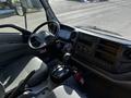 Interior view of a 2017 Hino 155 truck showing the steering wheel dashboard gear shifter and various controls