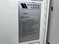 A metal identification plate of a 2008 International 7500 crane listing model number 600E2 and serial number 289496 with important registration and operational instructions