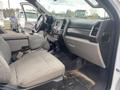Interior view of a 2017 Ford F-550 showing the driver's seat dashboard and center console with fabric upholstery and controls