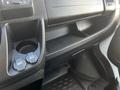 Interior view of a 2017 RAM Promaster showing the center console with cup holder USB and 12V DC power outlet