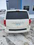 2012 Dodge Grand Caravan rear view with a white exterior and visible license plate 978 LWG