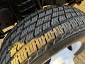 Close-up of a tire from a 2017 Ford Econoline showcasing detailed tread pattern and sidewall design