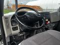 Interior view of a 2008 International 7500 with a black steering wheel dashboard controls and a driver's seat visible