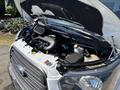 2016 Ford Transit engine with an open hood showcasing the engine components and layout