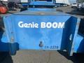A blue 1997 Genie S-65 4X4 lift with the words Genie BOOM displayed prominently on the side and a visible ID number CO-2270