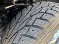 Close-up of a treaded tire from a 2015 Ford F-150 showcasing its detailed patterns and grooves designed for traction and stability