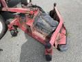 2012 Toro Groundsmaster 5910 mowing deck with four wheels and an attachment arm visible in a weathered red finish