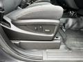 A close-up view of the power seat adjustment controls on the side of a 2016 Chevrolet Tahoe front seat