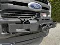A 2017 Ford F-250 SD featuring a black front bumper with a winch and hook attached