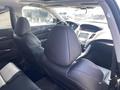 Interior view of a 2017 Acura TLX showcasing black leather seats and a dashboard with modern controls and a display screen