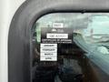 A certificate of approval sticker on a vehicle window displays the year 2027 and monthly expiration dates including January March and April