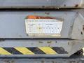 A warning label on a SkyJack SJ work platform displaying model number and serial number along with cautionary instructions against unsafe operation