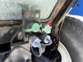 Close-up of two hydraulic couplers attached to a metal plate on a 2018 New Holland Boomer 45 tractor showing green and blue caps