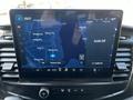Dashboard display of a 2022 Ford Transit showing a navigation map with streets and driving directions