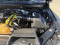 Engine compartment of a 2018 Ford F-150 showcasing the air intake system and various engine components