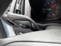 Close-up of the control stalk in a 2016 Ford Transit Connect showing turn signal and wiper controls