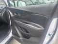 The interior door panel of a 2018 Buick Encore featuring black leather trim and various controls for windows and locks