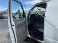 A 2008 Ford Econoline van with an open driver's door showing the interior including the steering wheel and driver's seat