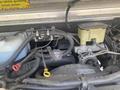 Close-up of the engine compartment of a 2007 Morgan Olson Workhorse W42 showing various components including hoses wires and a brake fluid reservoir