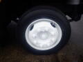 White tire rim on a 2008 Freightliner MT45 Chassis with a black tire mounted on it