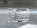 A 2018 Ford Transit with a vehicle emission control information label detailing compliance regulations and fuel specifications