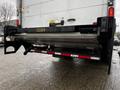 A 2018 Freightliner M2 106 with a hydraulic liftgate attached at the rear for loading and unloading goods