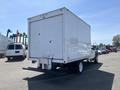 A 2008 Ford F-450 SD with a white box truck body featuring double rear doors and a rear step bumper