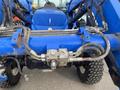 A 2016 New Holland T475 tractor showing hydraulic hoses and connection points on the front assembly