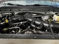 A 2016 Ford F-550 engine compartment showcasing the engine assembly with various hoses and components visible
