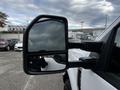 Close-up of the side mirror of a 2020 Ford F-250 SD displaying a reflective surface