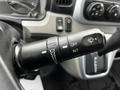 Close-up of the windshield wiper control stalk on a 2021 Mitsubishi FE featuring settings for mist off intermittent and low