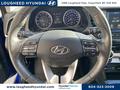 A 2020 Hyundai Elantra steering wheel with control buttons and a Hyundai logo visible in the center