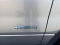 A silver 2014 Ford F-150 displaying an EcoBoost badge on its side panel