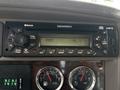 Kenworth T370 dashboard with an MP3 radio displaying FM station 91.5 and controls for audio settings and Bluetooth connectivity