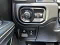 The image shows the control panel of a 2019 RAM 1500 featuring headlight switches and a button for fog lights