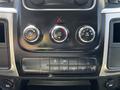 2023 RAM 5500 dashboard controls including knobs for air conditioning and auxiliary functions with various buttons for different settings